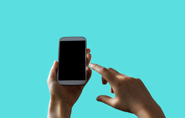 Person holding a white smartphone on a solid background