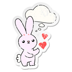 cute cartoon rabbit with love hearts and thought bubble as a distressed worn sticker