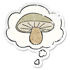 cartoon mushroom and thought bubble as a distressed worn sticker