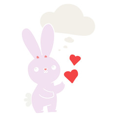 Obraz na płótnie Canvas cute cartoon rabbit with love hearts and thought bubble in retro style
