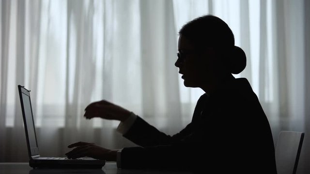 Over exhausted woman talking on phone with foreign partners working on laptop