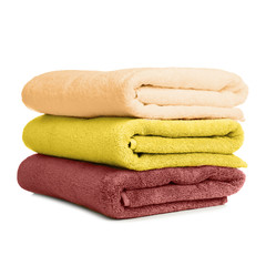 Folded soft terry towels on white background