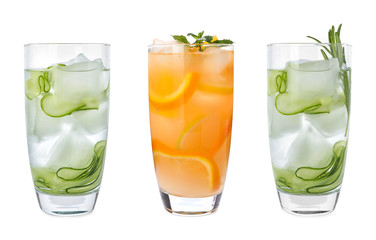Set of glasses with different refreshing drinks on white background