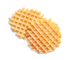 Delicious waffles for breakfast on white background, top view