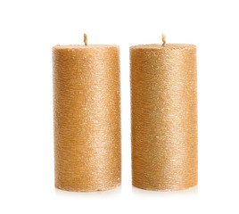 Stylish elegant gold candles on white background. Decor element