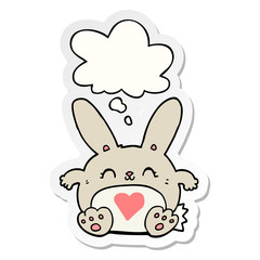 cute cartoon rabbit with love heart and thought bubble as a printed sticker