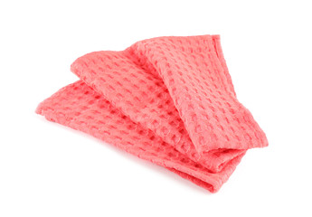 Folded coral kitchen towel on white background