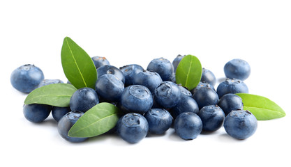 Fresh raw tasty blueberries with leaves isolated on white