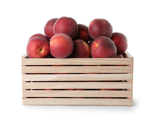 Crate of delicious ripe peaches isolated on white