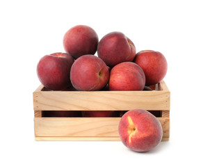 Crate of delicious ripe peaches isolated on white