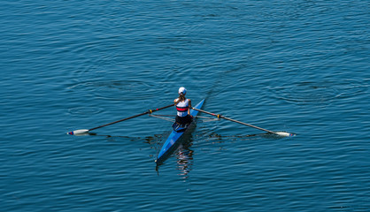 Single Female Rower In Racing Boat 