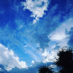 blue sky with clouds and sun