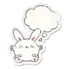 cute cartoon rabbit and thought bubble as a distressed worn sticker