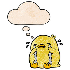 cartoon crying bird and thought bubble in grunge texture pattern style