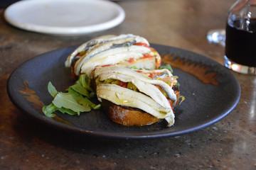 Plate of white anchovies