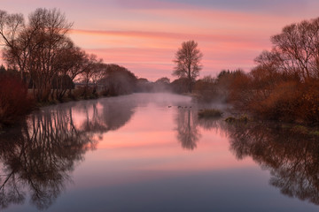 Sunrise on a river, Canterbury, New Zealand