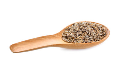 caraway seeds in wood spoon on white background