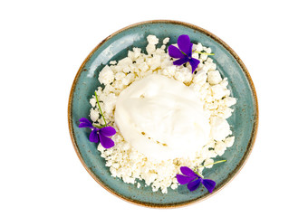 Blue plate with granulated cottage cheese. 