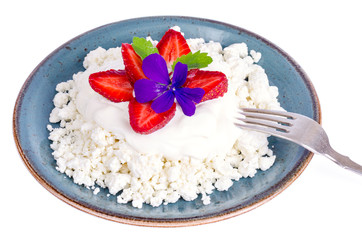 Fresh granulated cottage cheese with strawberries. Photo