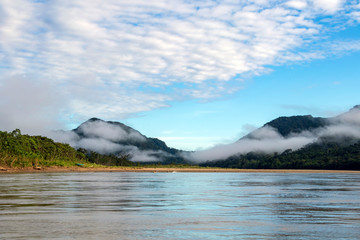 Green rainforest mountains in clouds, Amazon river basin, South America