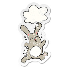 cartoon rabbit and thought bubble as a distressed worn sticker
