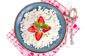 Fresh granulated cottage cheese with strawberries. Photo
