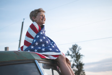 young boy with american flag