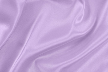 The texture of the satin fabric of lilac color for the background