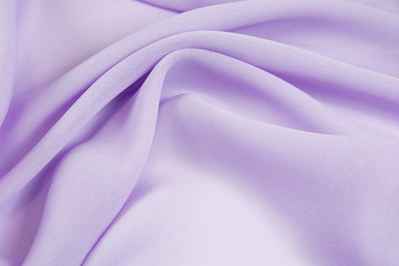 Obraz premium The texture of the satin fabric of lilac color for the background