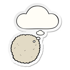 cartoon biscuit and thought bubble as a printed sticker
