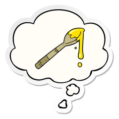 cartoon spoonful of honey and thought bubble as a printed sticker