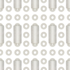 Seamless background of white reel of thread