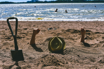 Man Buried in Sand