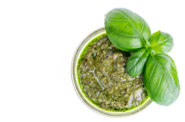 Pesto sauce and fresh green basil leaves. 