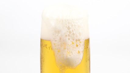 glass of beer with foam on white background