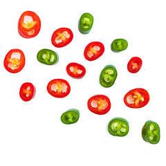 Fototapeta premium Flying Red chili pepper. Slices of Cayenne pepper isolated on white background, close up