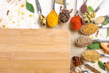 Various spices ( cumin, coriander, curry, paprika, chili, turmeric cinnamon, fenugreek, cardamom,...