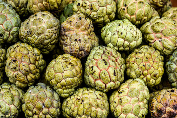 Close up Background and texture fresh custard apple fruit in the market.