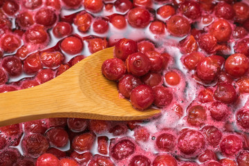 Photo of the process of making homemade cherry jam.
