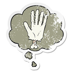 cartoon zombie hand and thought bubble as a distressed worn sticker
