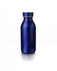 Bottle of dark blue color for drinks isolated on white background