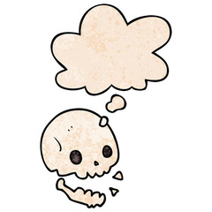 cartoon spooky skull and thought bubble in grunge texture pattern style