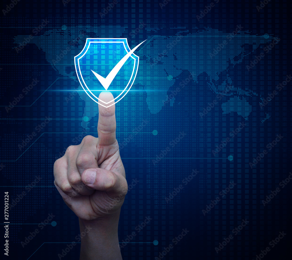 Poster hand pressing security shield with check mark icon over digital world map technology style, internet