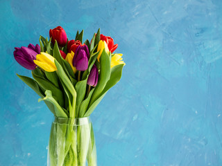 bouquet in a vase of colorful tulips