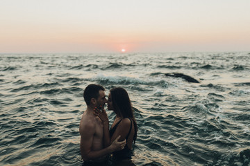 lovely couple kissing in the sea