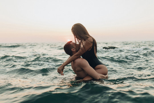 lovely couple kissing in the sea