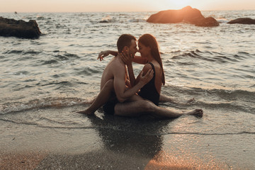 lovely couple kissing in the sea