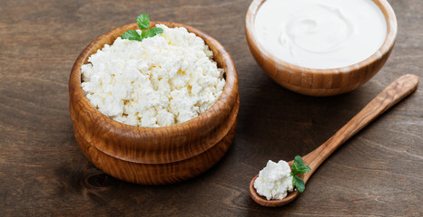 Organic cottage cheese  in a wooden bowl.