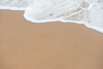 Fototapeta na wymiar Sand beach with wave of water for background.