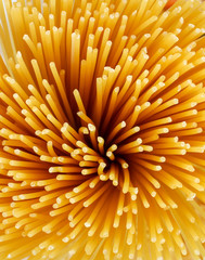 Yellow long spaghetti. Yellow italian pasta. Long spaghetti. Raw spaghetti bolognese. Raw spaghetti. Food background concept. Italian food and menu concept.